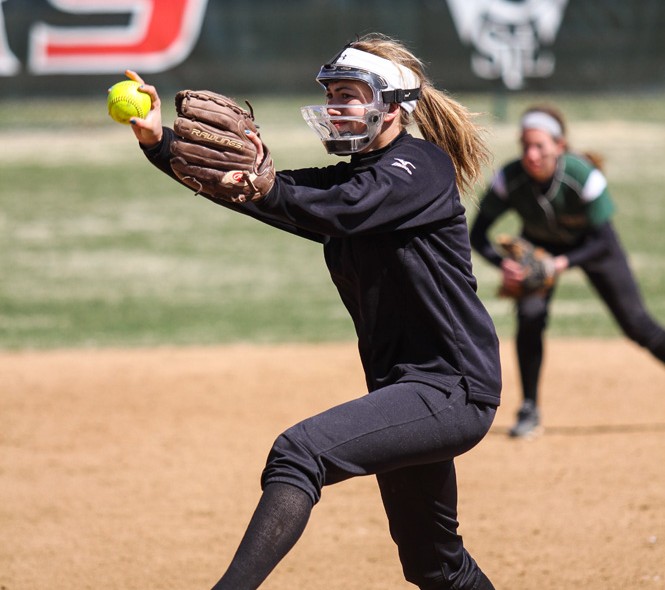 Then-sophomore starting pitcher Annie Pitkin winds up for a pitch on March 23, 2014 against Coe College. On Sunday, Pitkin pitched a complete game, surrendering five hits and four earned runs while striking out seven in a 6-4 win against Fontbonne University.
