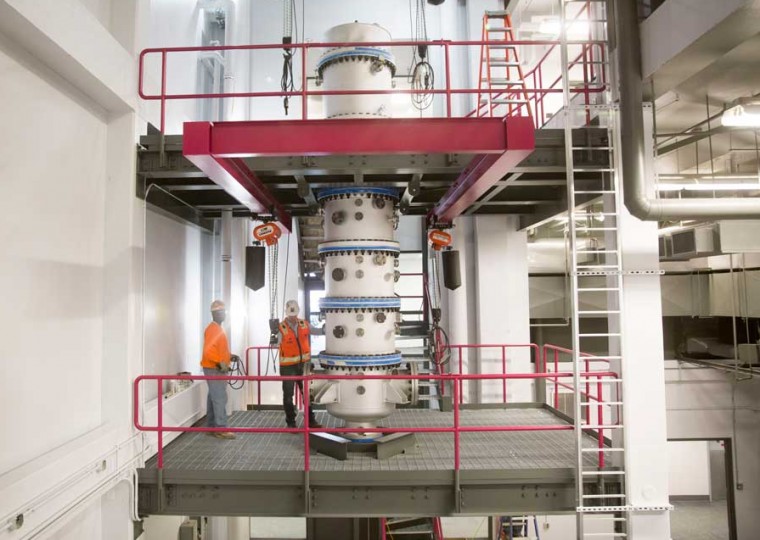 Workers place the finishing touches on the space for Urbauer Hall's lab-sized pressurized oxy-combustor. In two to three months, CCCU Director Richard Axelbaum and his team will begin work with the device, the first of its kind.