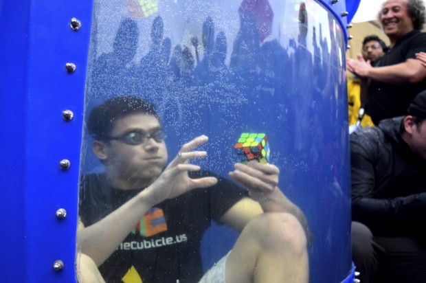 Kevin Hays, a member of the Wash. U. swim team, breaks the world record for most Rubik’s Cubes solved while underwater. Hays completed the challenge of solving eight cubes within a single breath after two attempts.