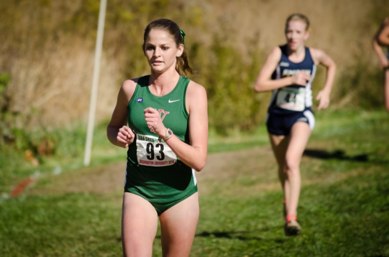Then-junior Ellen Toennies races to the finish line in the UAA Championship race on Nov. 1, 2014. Toennies finished 11th as the women’s team placed first at the University of Wisconsin-Oshkosh AAE Invitational Pre-National race on Saturday.