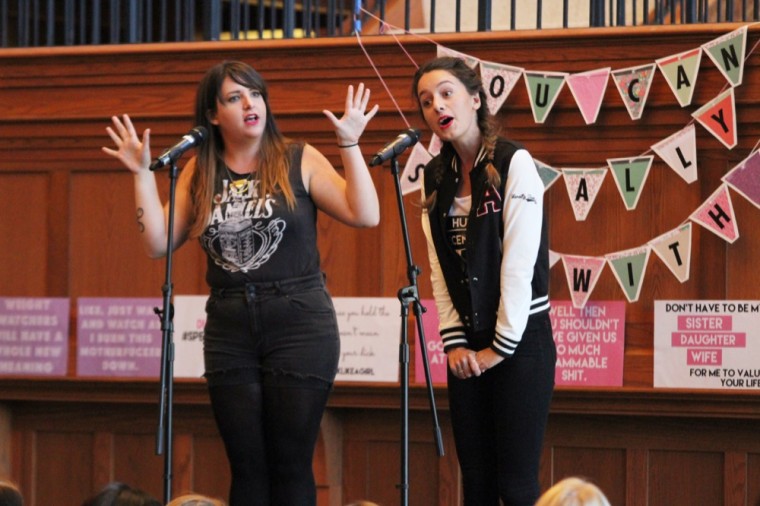 Megan Falley (left) and Olivia Gatwood, the poets of the Speak Like a Girl tour, present their hour-long educational feminist show to a crowded Tisch Commons on Monday afternoon. They presented poetry, dialogue and performances that focused on exposing common problems about gender inequality.