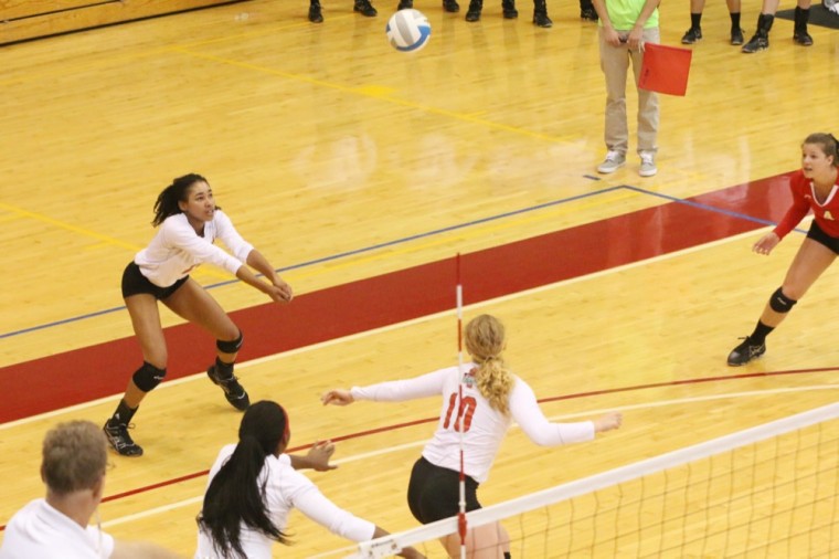 Senior Nkiru Udenze helps make a play during the Bears' 3-0 win over Cornell College on Sept. 12th. This weekend, the volleyball team won all three games during the first round of the UAA Round Robin, which was held at New York University.
