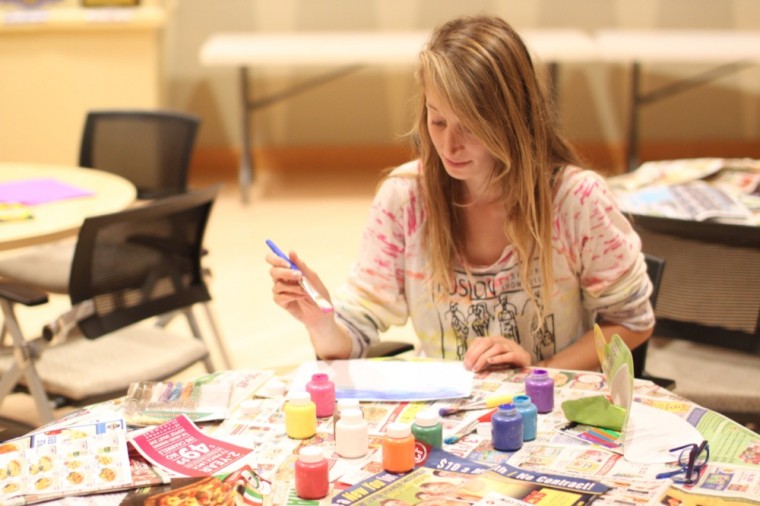 Senior Chelsea Birchmier, president of Active Minds, creates a painting during the student group's de-stressing event, which was held in Ursa's on Tuesday evening.