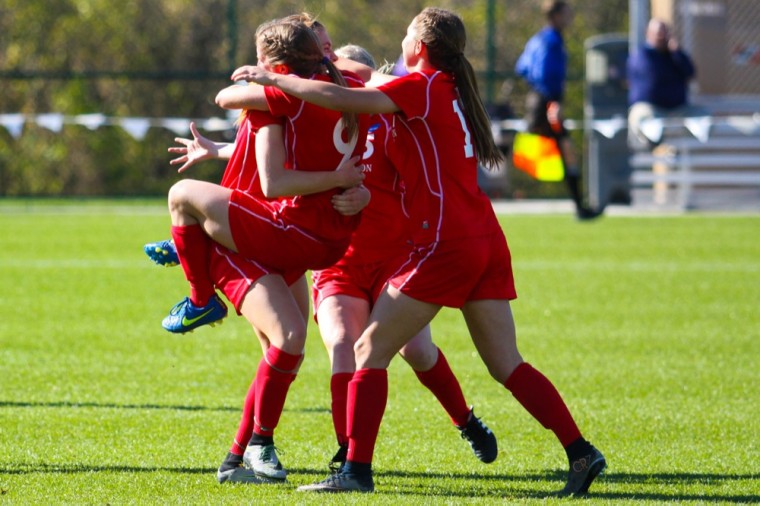 The women’s soccer team celebrates after Messiah College’s sixth penalty-kick shooter missed during Friday’s national semifinals, sending the Bears to the championship game.