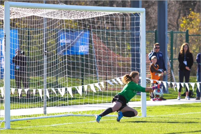 Junior goalkeeper Lizzy Crist makes one of her five saves during Friday’s semifinal match. With an additional seven saves during the championship, Crist was named the tournament’s defensive MVP.