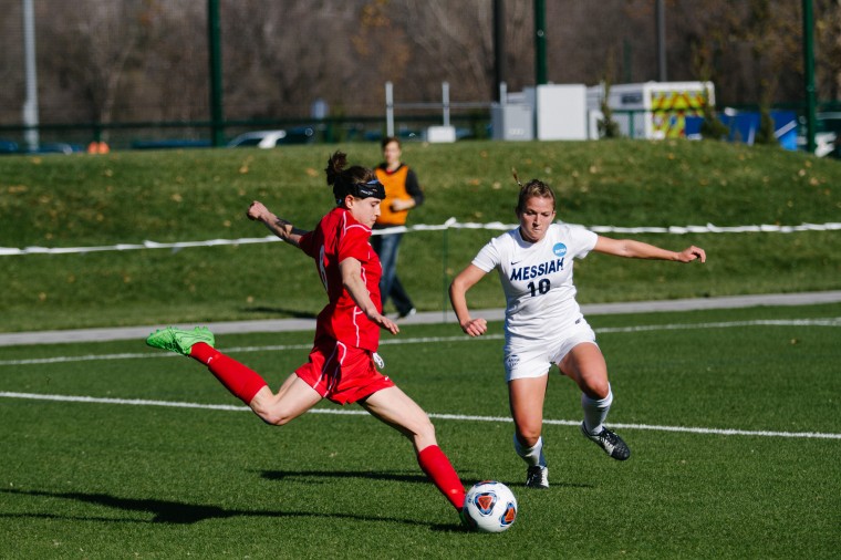 Junior Hannah Rosenberg goes for a shot during the Dec. 4 semifinal game against Messiah College. Rosenberg’s penalty kick goal keyed the Bears to a 3-2 victory, sending them to Saturday’s championship game.