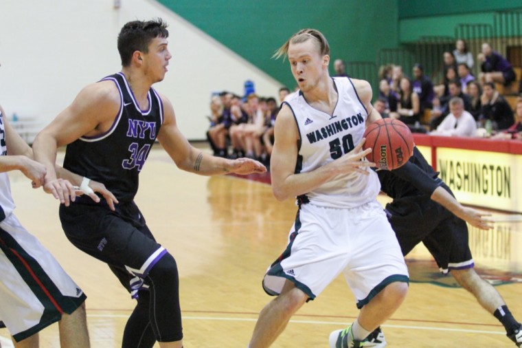 Forward Matt Highsmith forces his way to the basket in the Bears’ game against New York University. Highsmith led the team with 14 points in Wash. U.’s 75-72 loss.