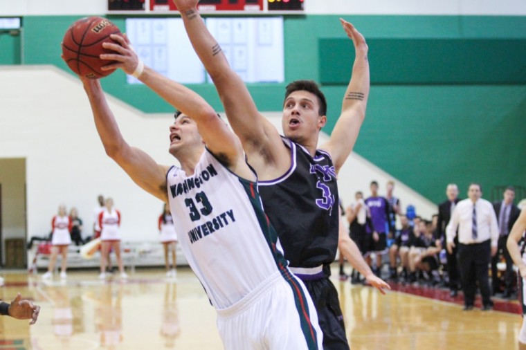 Sophomore Andrew Sanders takes a shot at the Bears’ game against New York University on Jan. 24. The forward averages 15.8 points per game thus far this season.