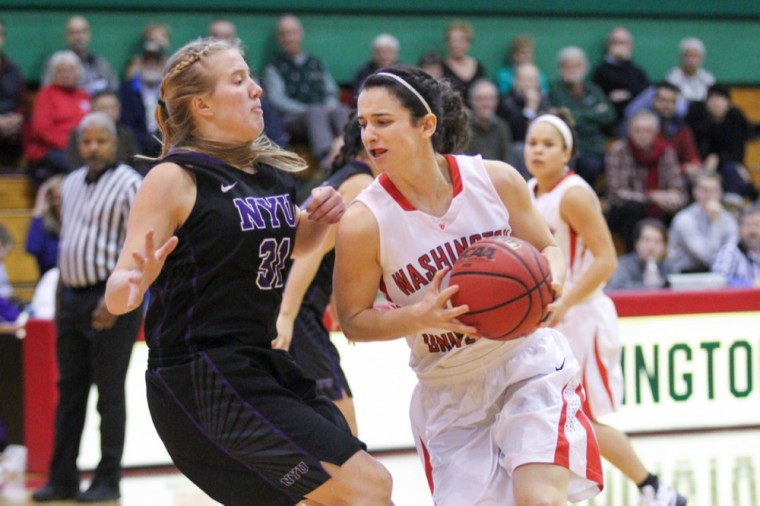 Amanda Martinez drives toward the basket in the Bears’ loss against New York University Sunday afternoon. Martinez led the team with 13 points and eight rebounds.