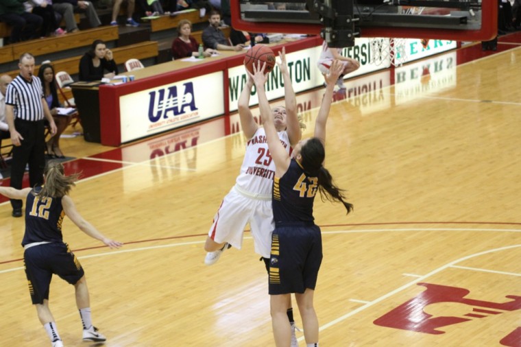 Junior Lily Sarros goes up for a shot during Sunday’s game against Emory. The Bears came out with a 75-68 victory.