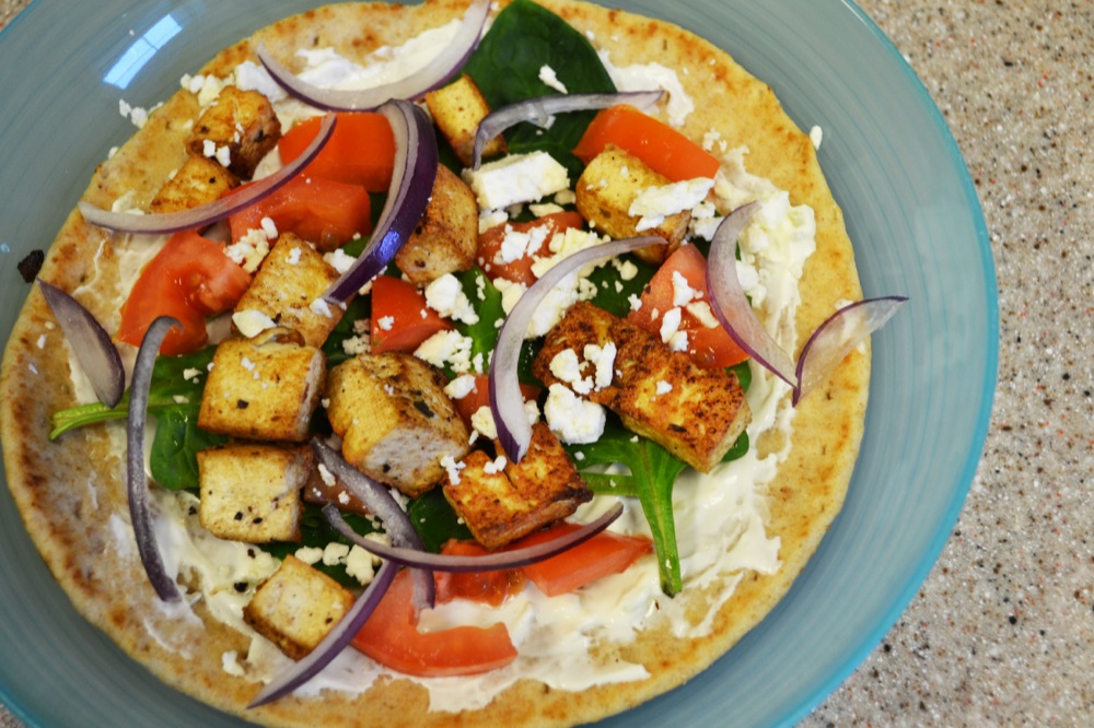 The finished tofu gyro from UKitchen sits plated after cooking.