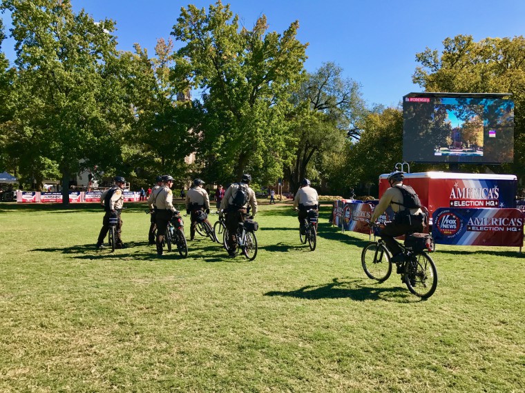 St. Louis County police ride bikes across Mudd Field.