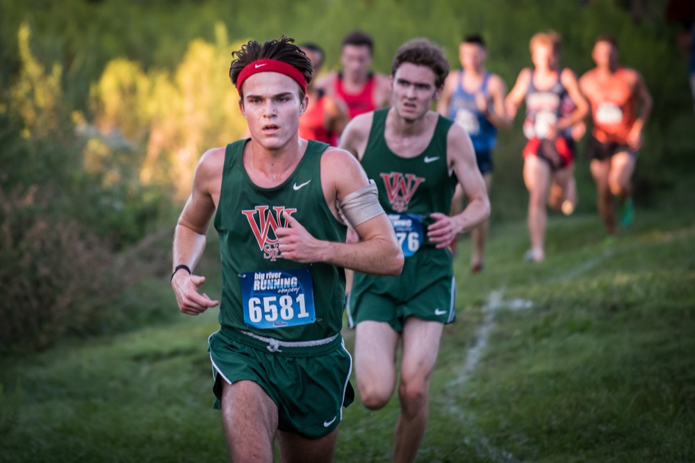 Members of the cross country team compete in the Gabby Reuveni Early Bird in Forest Park on Sept. 2. Both the women’s and men’s cross-country teams won UAA conference championships over the weekend at Whitesburg, Ga.