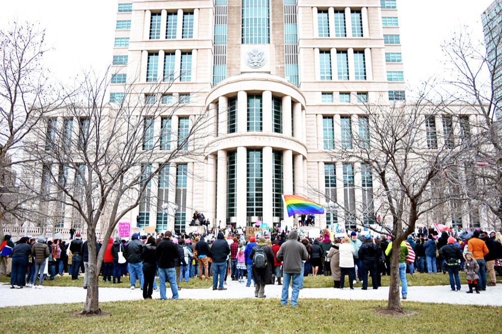 Protesters march to the Arch in opposition to Trump executive order