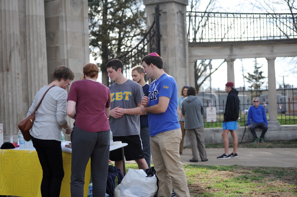 Members of Wash. U. fraternity Zeta Beta Tau give away free water bottles to volunteers at Chesed Shel Emeth Cemetery. President and sophomore Perry Gordon said that around 20 brothers assisted at the cleanup event.