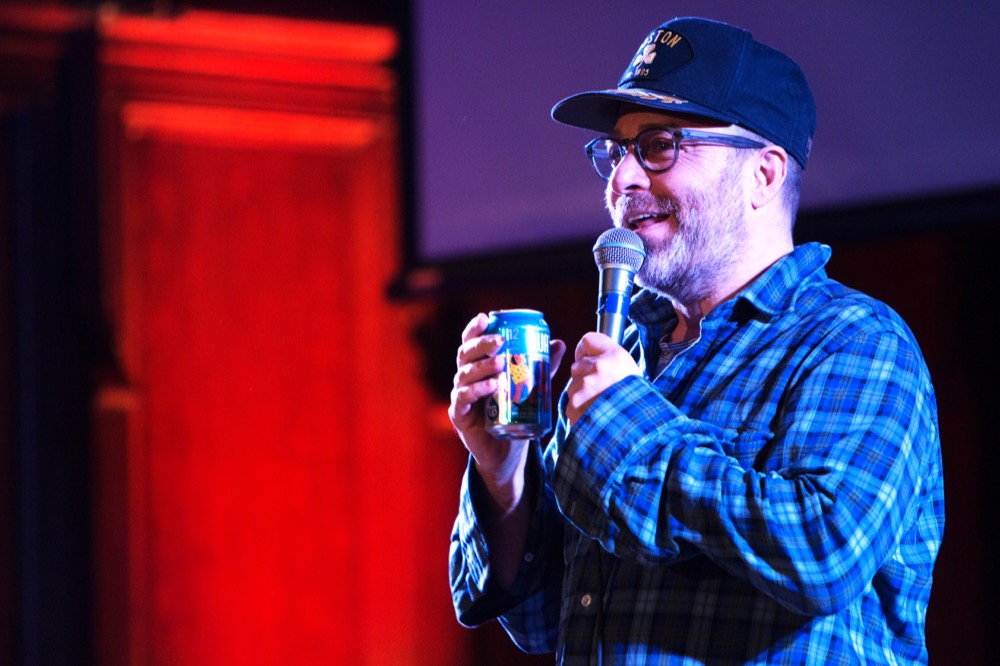 Comedian H. Jon Benjamin holds canned water as part of his routine at Graham Chapel Wednesday evening. Benjamin was selected based on the results of Social Programming Board's survey this semester.