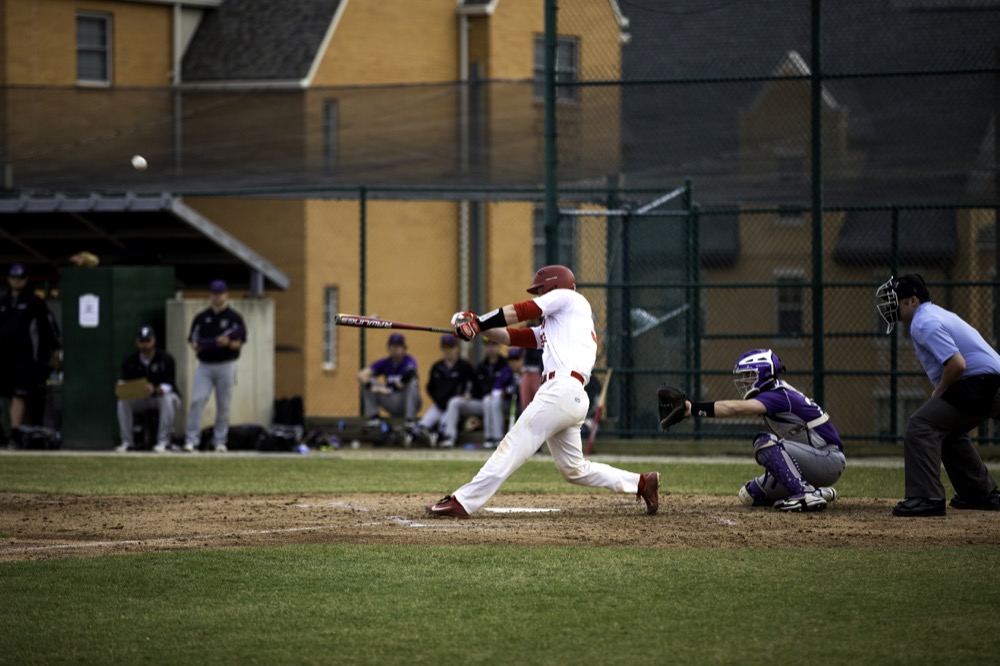 Senior catcher Tate Maider hits a home run in the Bears’ game aganist Fontbonne University on Wednesday afternoon at Kelly Field. The Bears won the Wydown Showdown 10-2.