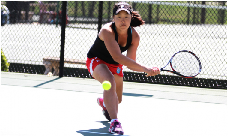 Senior Rebecca Ho goes low for a backhand in a match last year. Ho helped the women’s tennis team take fourth at the ITA National Team Indoor Championships this past weekend.