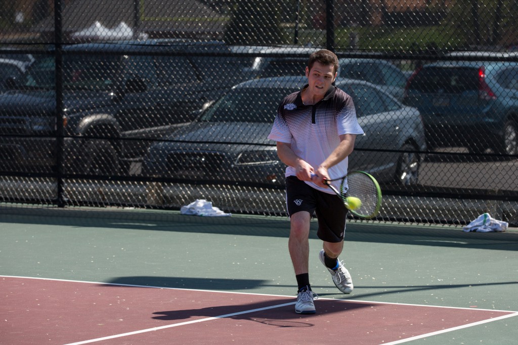 Senior Jeremy Bush hits the ball with a backhand during a match against Southwest Baptist University. Bush won his match this weekend in a third set tie break this weekend, leading to a Bears team win against No. 5-ranked University of Chicago.