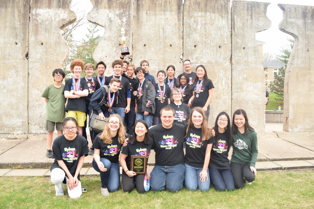 The coaches of the Wydown Middle School science olympiad team pose with the team’s members. The team, which was initially introduced four years ago due to Washington University student interest, will be attending its first national competition May 20 in Dayton, Ohio.
