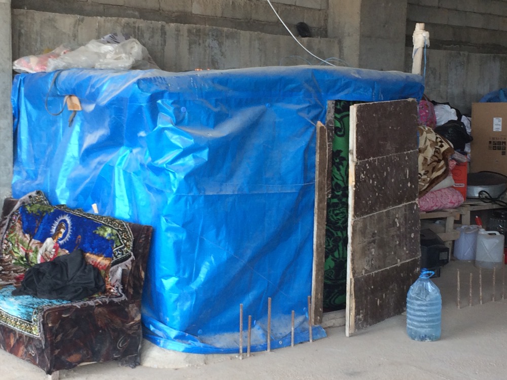 Refugee families in Erbil build their shelters in the skeletons of unfinished buildings. 