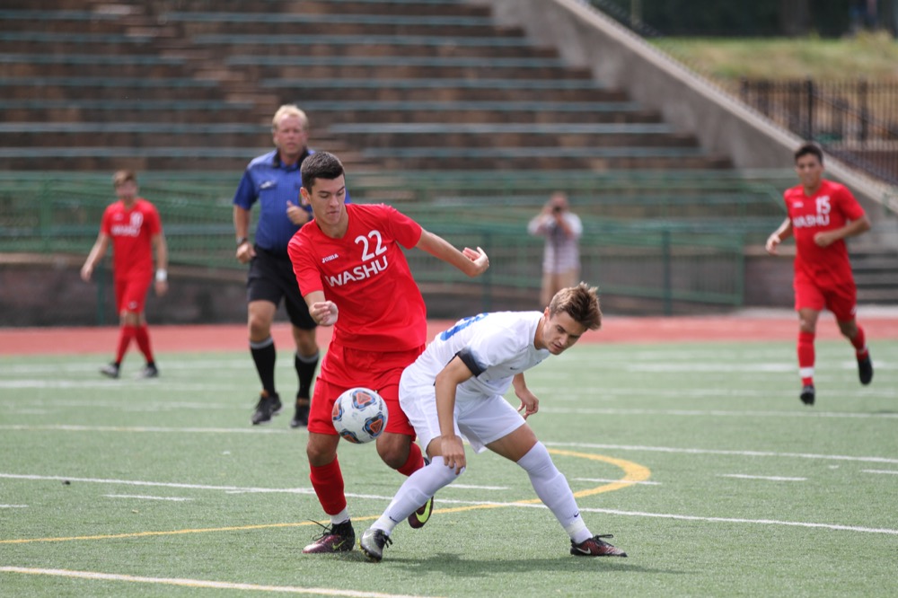 Junior Kyle Perez battles for the ball against a Luther defender in a game last year. Coming off of a double-overtime win against Wheaton, the Bears’ record improves to 5-0-1 on the season.