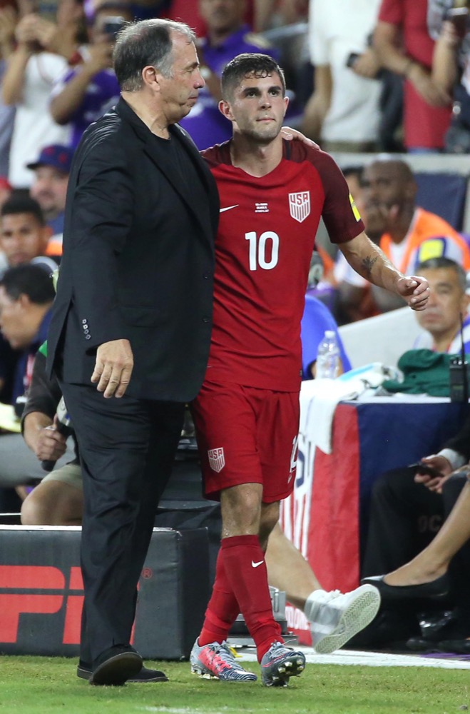 US Men’s National Team Head Coach Bruce Arena walks with Christian Pulisic during a World Cup qualifying match aganist Panama. In a shocking upset, the men’s national team lost to Trinidad and Tobago 2-1, knocking them out of the World Cup next year in Russia.
