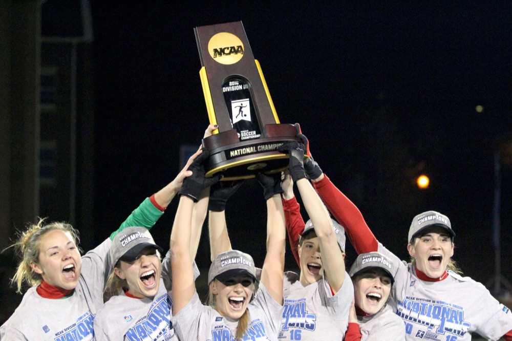 The women’s soccer team shows off the championship trophy after defeating Messiah College to claim the NCAA Division III title in December 2016.