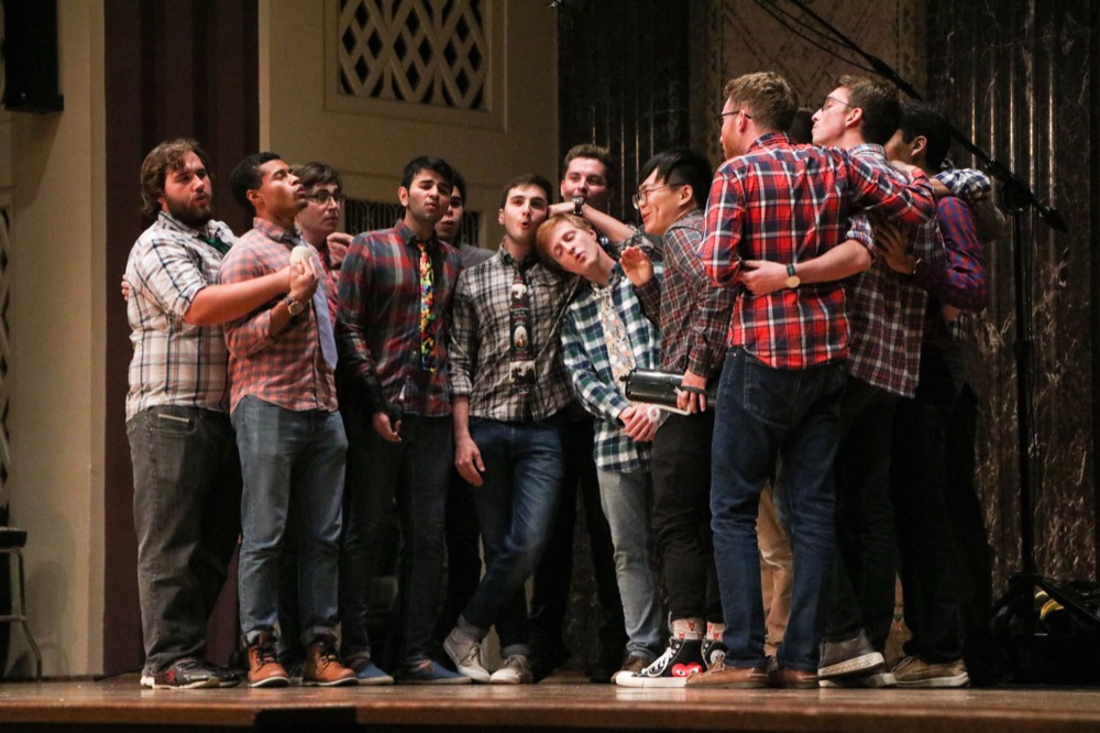 The Pikers, the oldest a cappella group on campus, sing onstage. The band is known for their quirky patterned T-shirts.