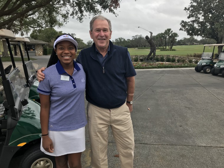 Sophomore golfer Angelica Harris poses with former U.S. President George W. Bush at a golf course in Orlando, Fla., where both of them attended a charity tournament for The First Tee.