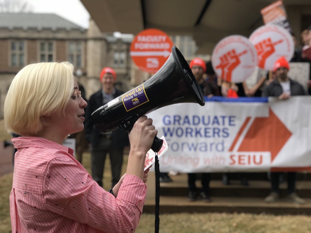 A member of the Graduate Workers Union leads a rally in Brookings Quadrangle Feb. 14.