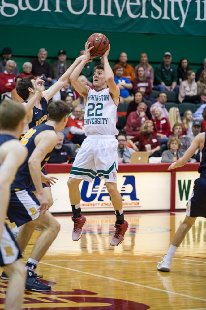 Freshman guard Jack Nolan handles the ball in the Bears’ 77-63 victory against University of Rochester at home Feb. 2.