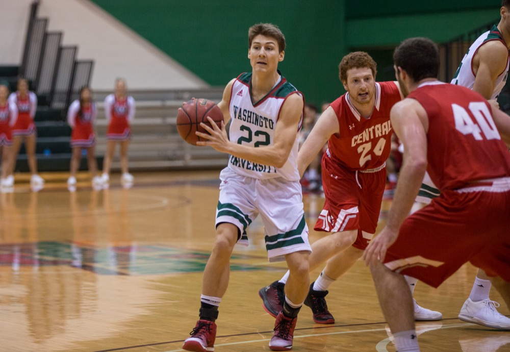 Nolan looks to pass in the Red and Green’s game against Central Iowa Dec. 9. The men’s basketball team came away with a win in the game, defeating Central Iowa by a score of 87-83.