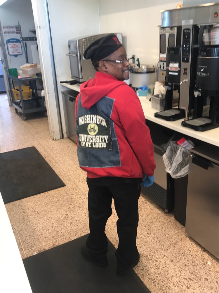 Melvin, an employee at Etta’s Cafe , wears a customized jean jacket-hoodie that he purchased from WUpcycle last week.