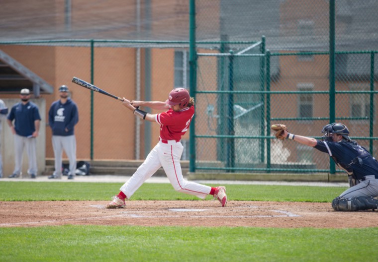 Auggie Mense takes a swing during Wash. U.’s game against Case April 21. The only senior on the team this season, Mense leads the Bears in walks and is second in on-base percentage. 
