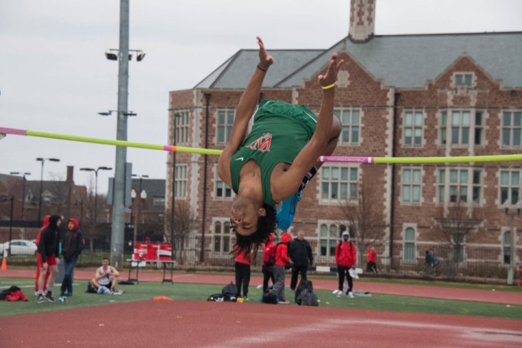 Collis McKenzie clears the bar at the high jump during the Wash. U. Track and Field Invitational March 31. This weekend, McKenzie took third as Wash. U. won first at the Greenville Select.
