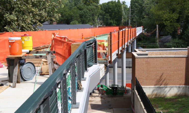 Construction on the Overpass continues as the University prepares for the school year. The Overpass, now expected to reopen in October, will be widened to 18 feet and will feature separated bike and pedestrian lanes.