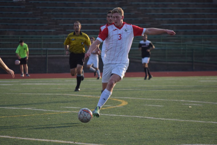 Ryan Sproule takes a shot on goal against Greenville University last year. Sproule had a game-high record of five shots with three on goal as Wash. U. lost to DePauw University on Friday.