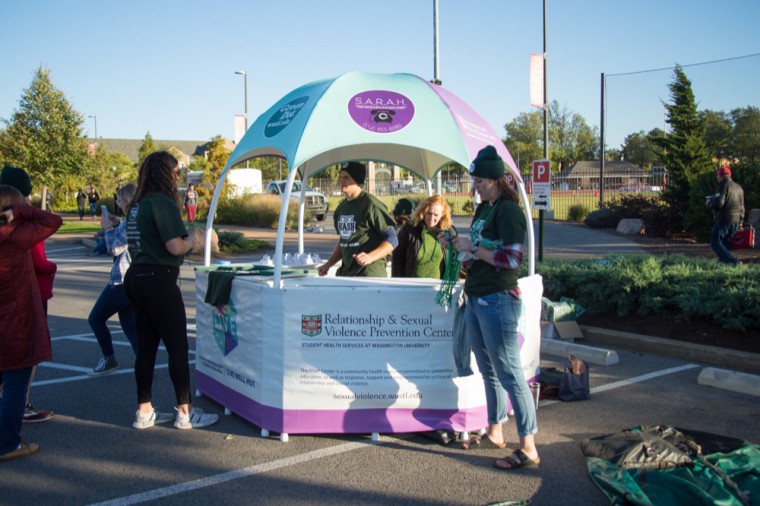 The RSVP Center and LIVE table for Green Dot Programming at Student Union’s Game Day event. Representatives handed out t-shirts, hats and beads to promote bystander intervention.