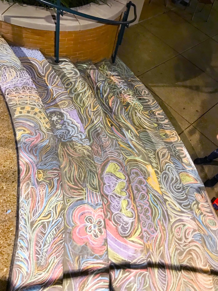 Chalk art on the steps outside of Bear’s Den on the South 40 by freshman such as David Massey. Massey and several classmates came up with the idea while learning about reflection in their Design and Creativity class.