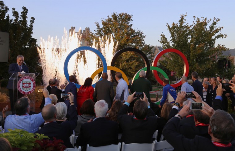 The Olympic rings sculpture is unveiled to Washington University spectators. The unveiling featured a wide variety of St. Louis-affiliated Olympic athletes and a small pyrotechnics display.