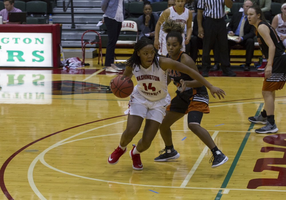Freshman guard Samantha Weaver drives past a University of Texas at Dallas defender in the Bears’ season opener in the McWilliams Classic Friday night. Wash. U. lost 86-77 but recovered with a 101-43 victory over Blackburn College Saturday.
