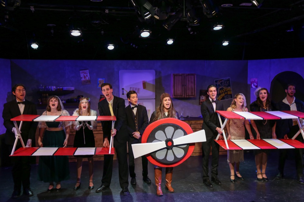 Cast members sing onstage during a scene in “The Drowsy Chaperone”, Cast N’ Crew’s fall performance. Cast N’ Crew exec chose the musical for its touching, yet comical, themes and songs.