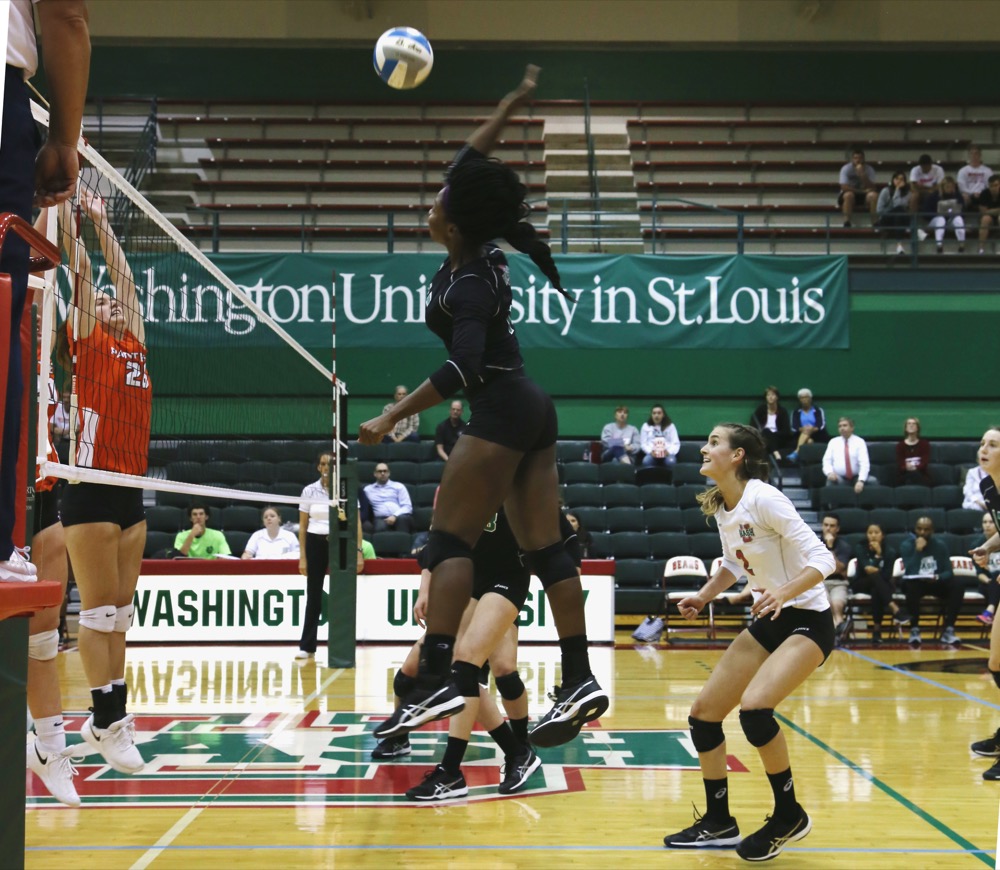 Senior outside hitter Ifeoma Ufondu goes up for a kill against Millikin University. The No. 13 ranked Washington University volleyball team fell 3-1 to No. 11 ranked Illinois Wesleyan University Saturday in the second round of the NCAA Division III Tournament in Chicago, ending their post-season run in the playoffs.