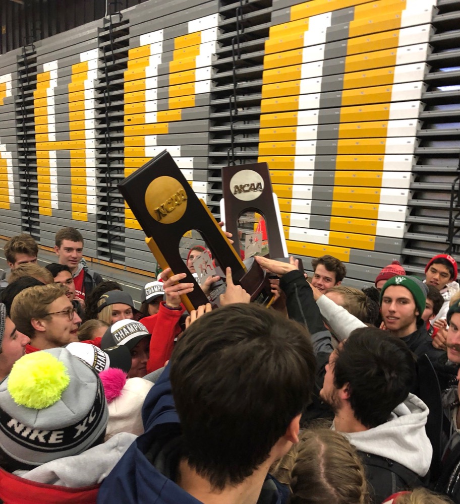 The cross-country teams celebrate after the women’s team won and the men took second at the NCAA National Championship Saturday.