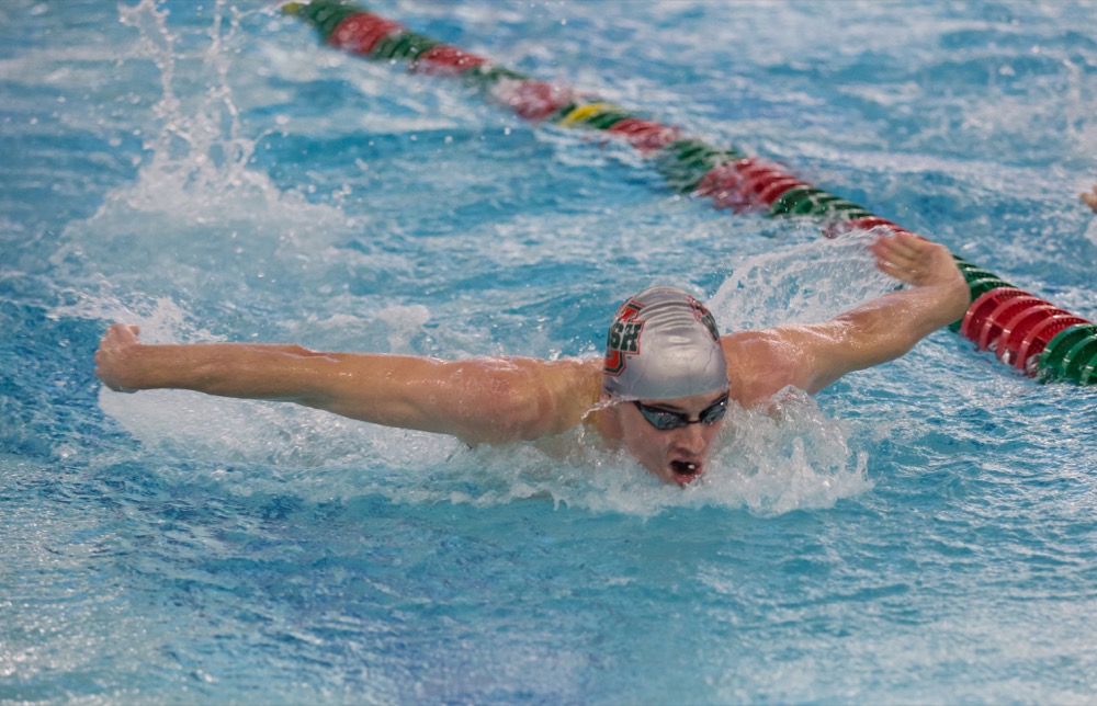 Senior Max Cardwell swims in a meet against Saint Louis University Sept. 29. This weekend, the men's and women's swimming and diving teams took third and fifth, respectively, at the Denison Invite.