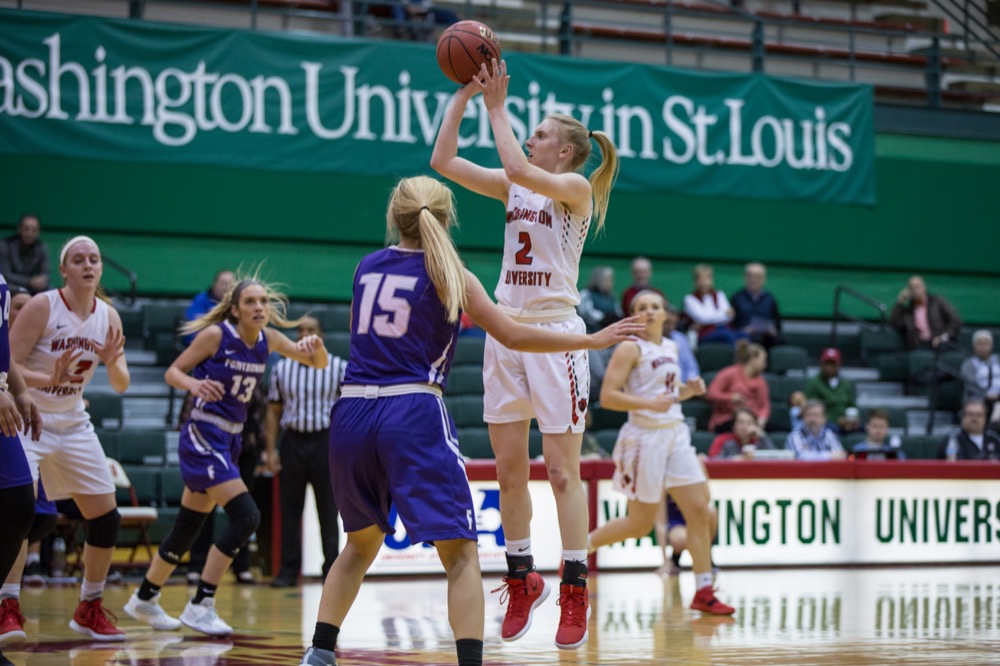 Freshman Hayley Semple shoots over a Fontbonne defender in the Field House on Dec. 11. After beating New York University 70-61 Friday night, Wash. U. defeated Brandeis University 101-67 Sunday afternoon to extend their win streak to six games.