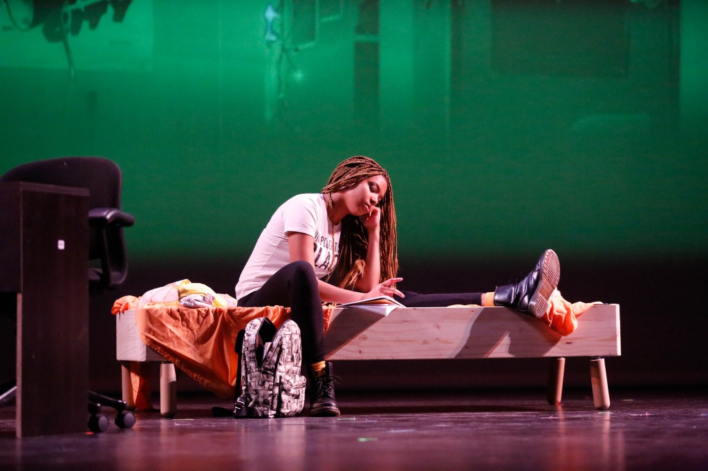 Raven (sophomore Anna Rittenhouse) sits on her bed during a skit from last year’s Black Anthology, “1:05.” “1:05” dealt with issues of relationship violence, an issue that disproportionally affects black women, little is currently known about this years performance, “The Creation.”