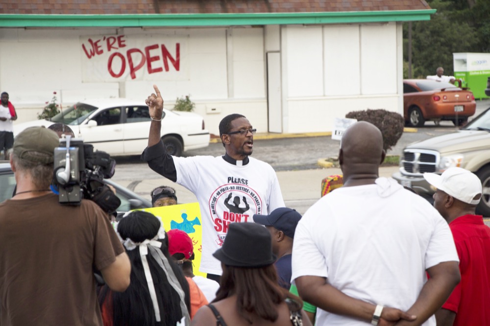 A pastor addresses the shooting of Michael Brown and the resulting protests to a crowd in Ferguson, Mo. in 2014. The crowd gathered in support of the Black Lives Matter movement and included Wash. U. students who drove to Ferguson with the Association of Black Students.