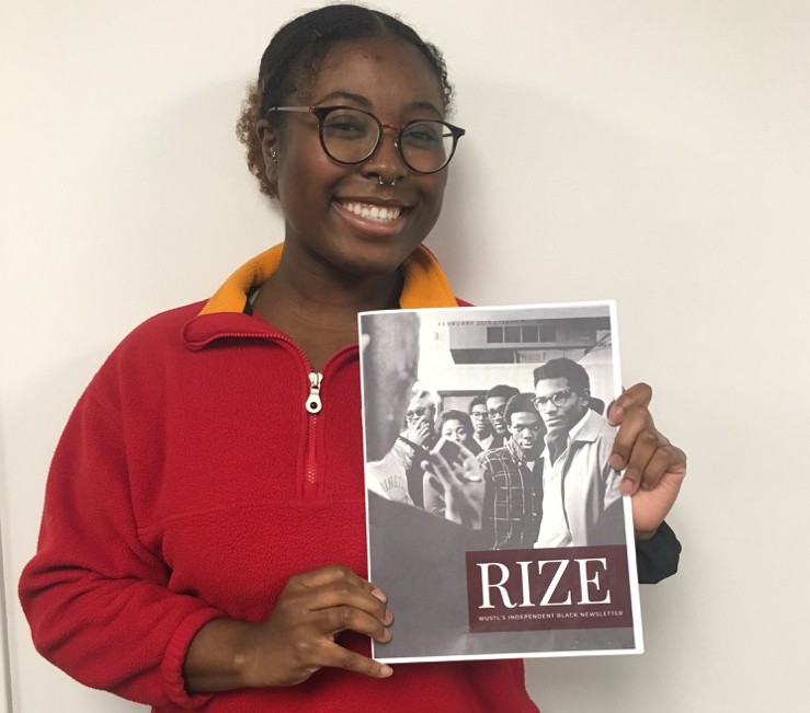 Rize’s editor-in-chief, Efua Osei, poses with the first issue of Washington University’s independent Black student newsletter.